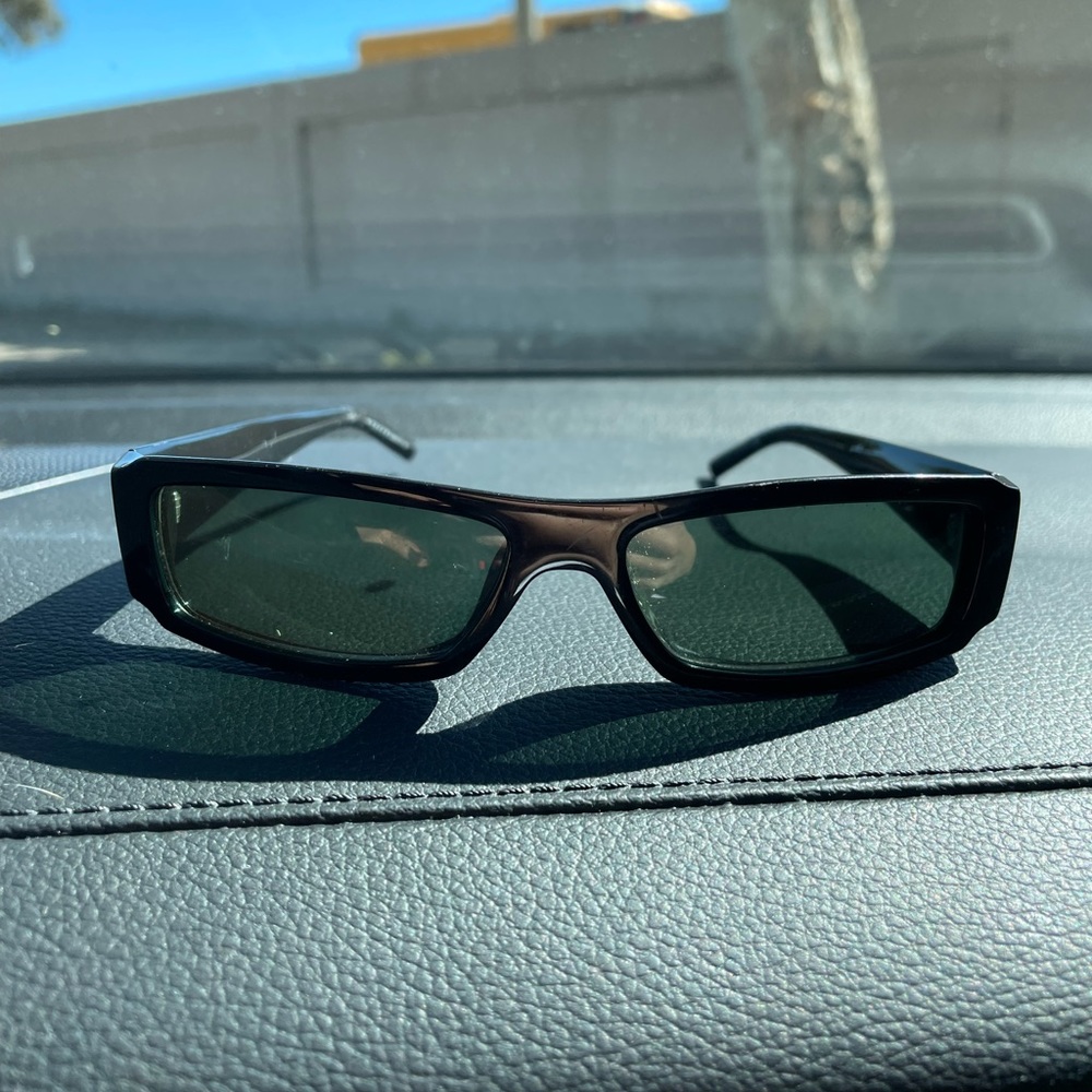 Small black framed Gucci sunglasses